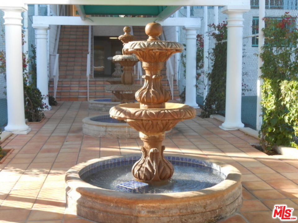 26664 Seagull Way, Unit A105 Malibu, CA 90265 - Photo 20 of 23 a vase of flowers sitting on a table