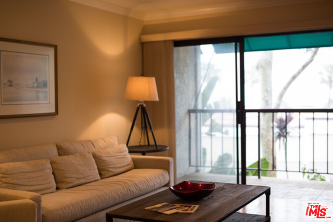 26664 Seagull Way, Unit A105 Malibu, CA 90265 - Photo 6 of 23 a living room with furniture and a large window