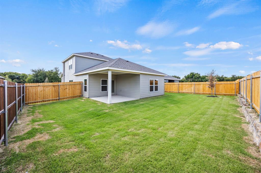 1017 Verde Creek Crowley, TX 76036 - Photo 17 of 20 a view of a house with backyard and garden