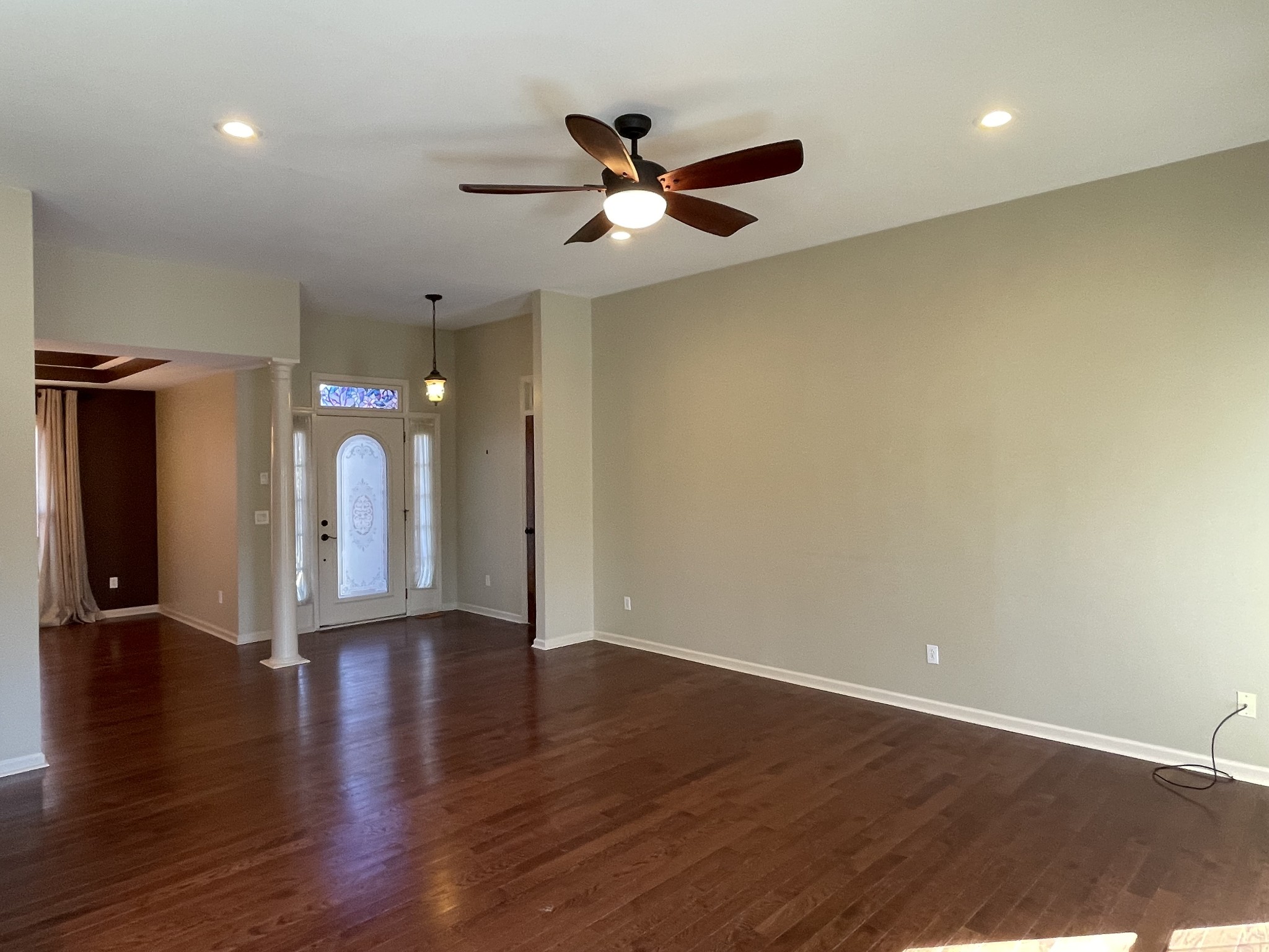 514 Lakeside Drive Springfield, TN 37172 - Photo 18 of 36 a view of an empty room with wooden floor and a ceiling fan