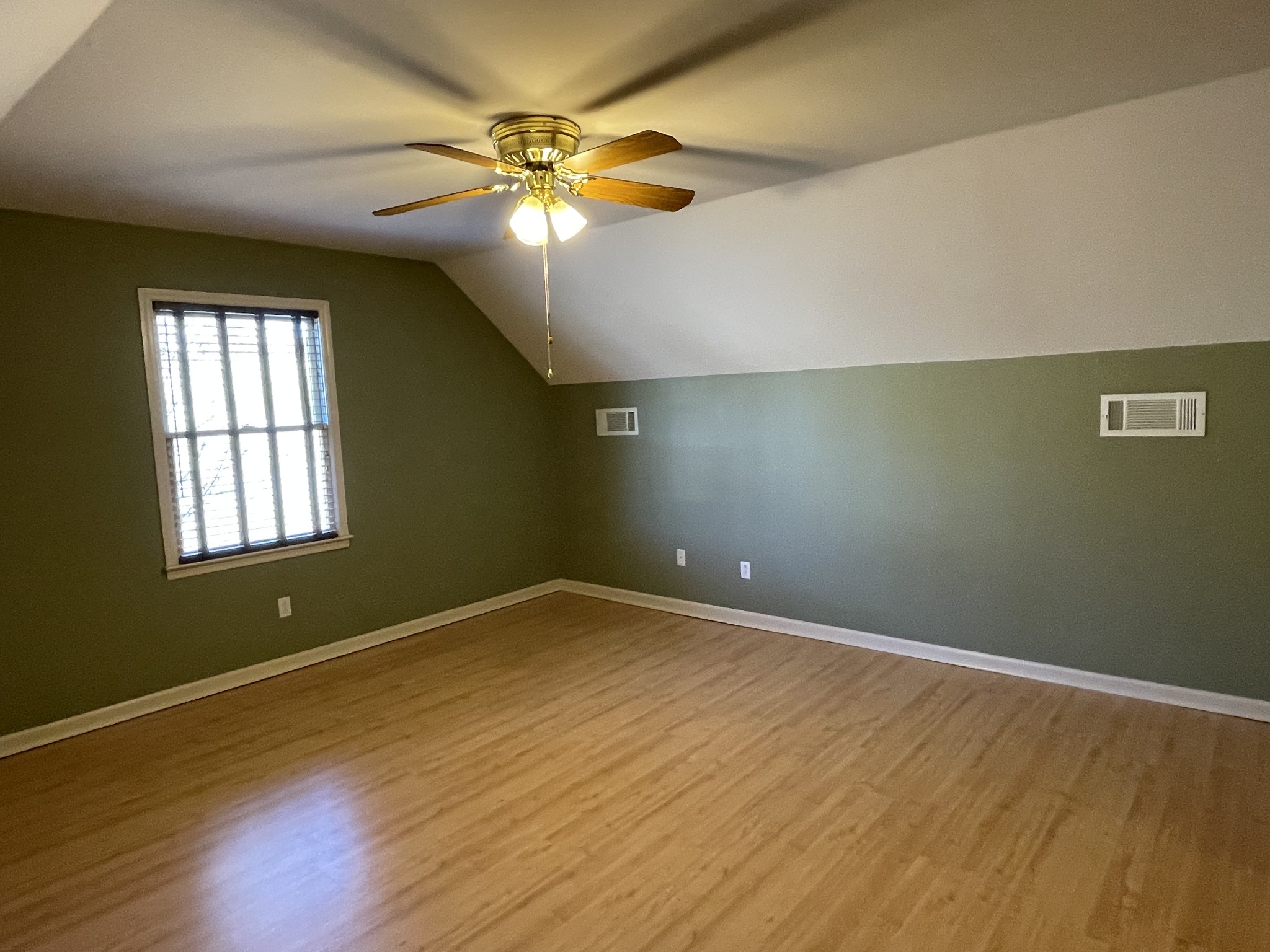 514 Lakeside Drive Springfield, TN 37172 - Photo 28 of 36 an empty room with wooden floor and windows