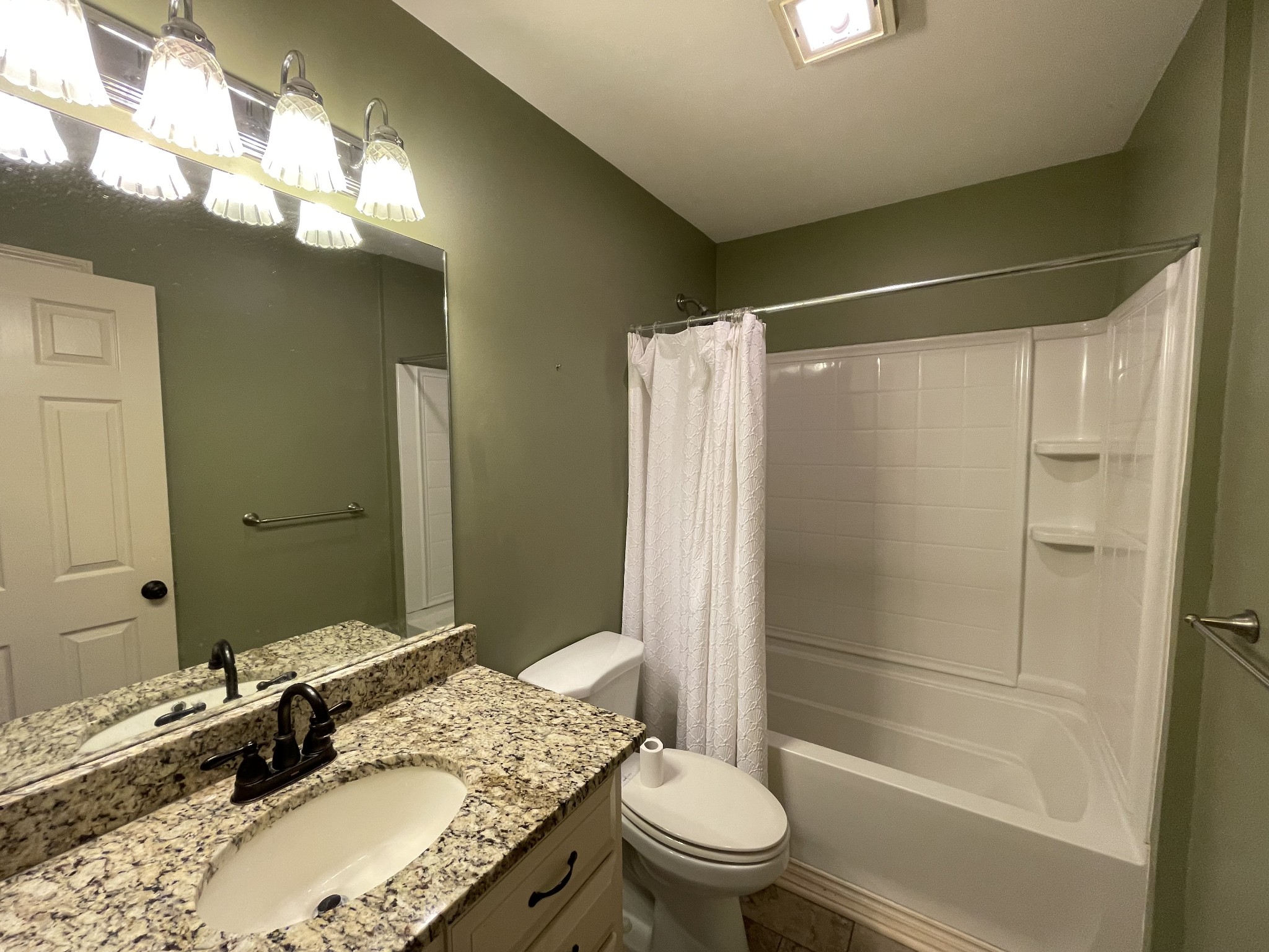 514 Lakeside Drive Springfield, TN 37172 - Photo 31 of 36 a bathroom with a granite countertop sink toilet and shower