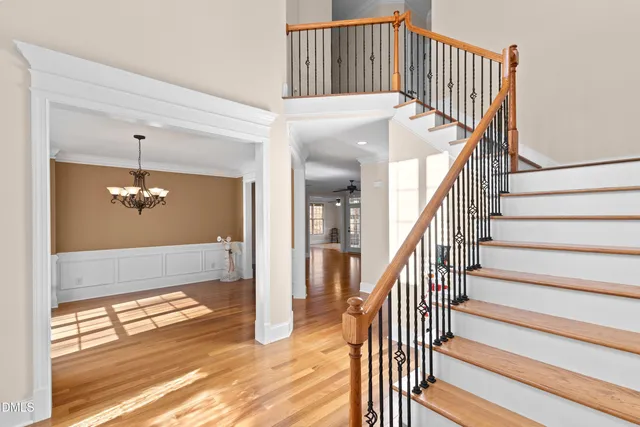a kitchen with stainless steel appliances granite countertop a stove and a wooden floors