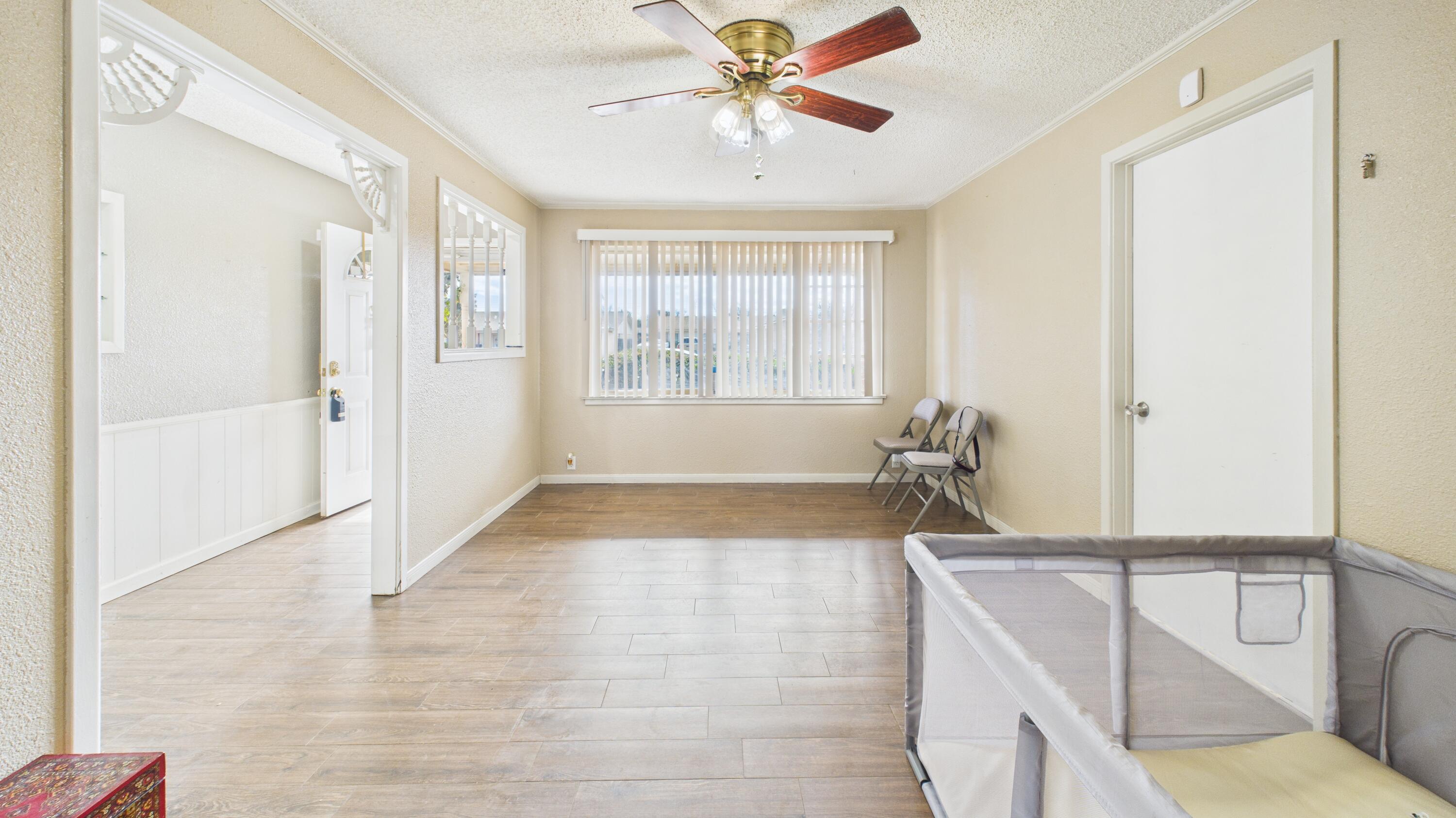 5410 41st Street Lubbock, TX 79414 - Photo 11 of 40 a view of a livingroom with a ceiling fan and window