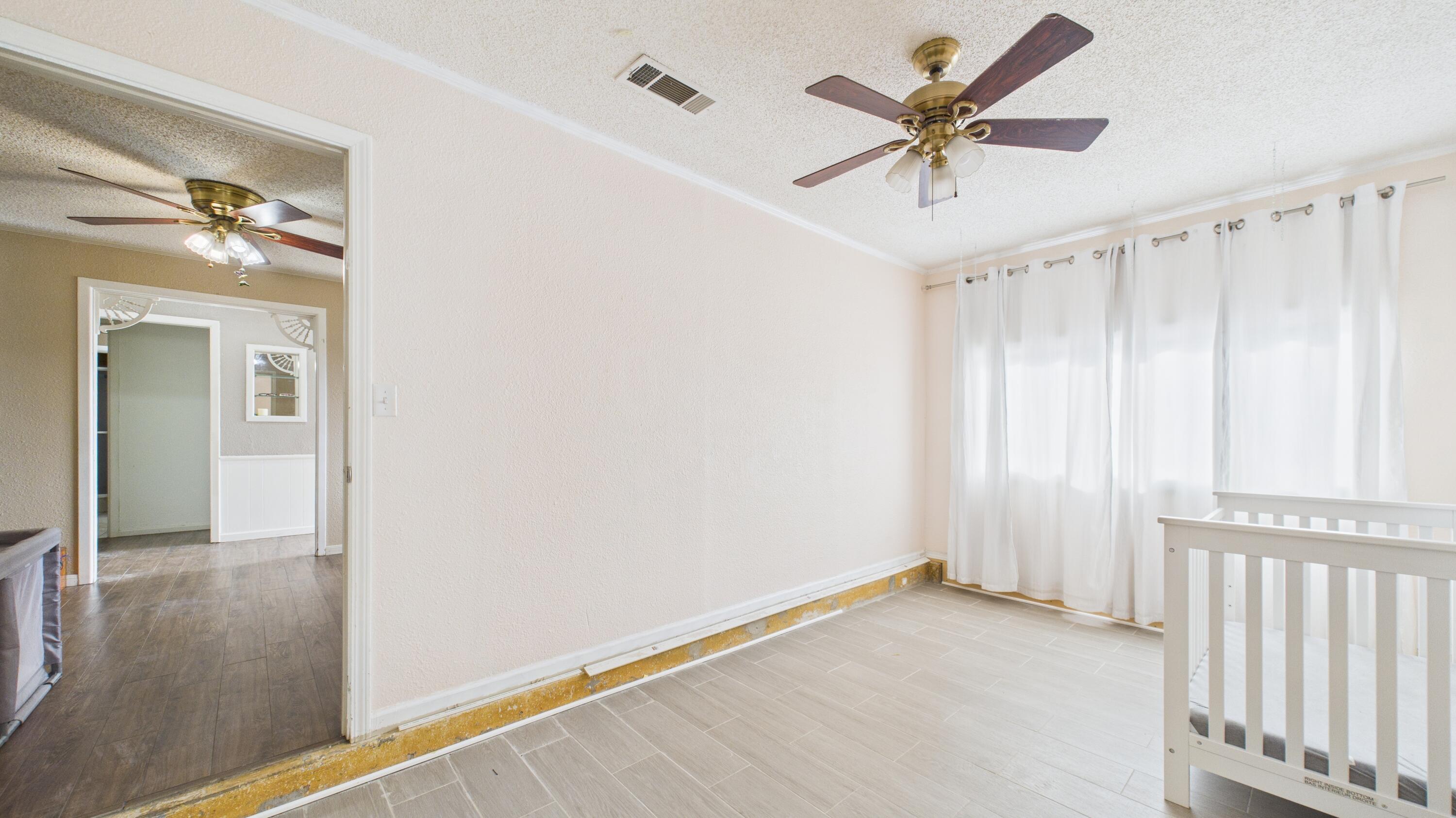 5410 41st Street Lubbock, TX 79414 - Photo 15 of 40 wooden floor in an empty room with a window