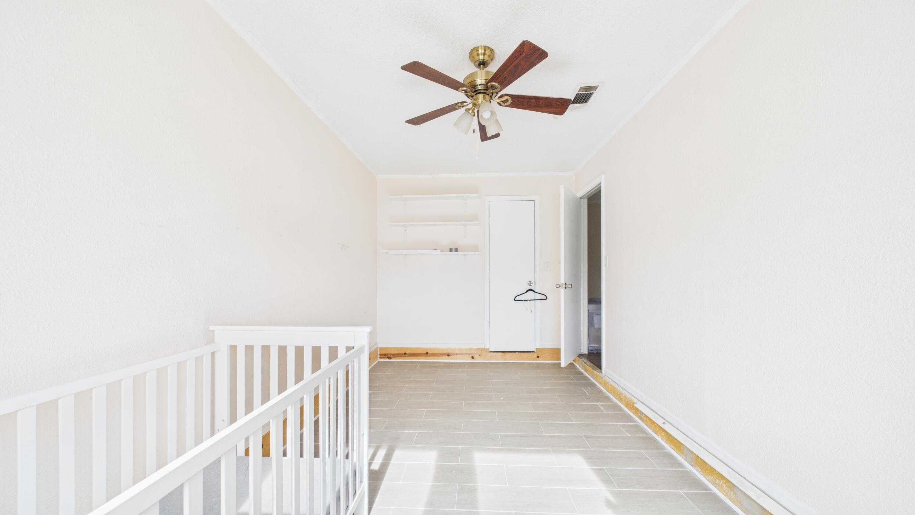 5410 41st Street Lubbock, TX 79414 - Photo 16 of 40 a view of a livingroom with a ceiling fan