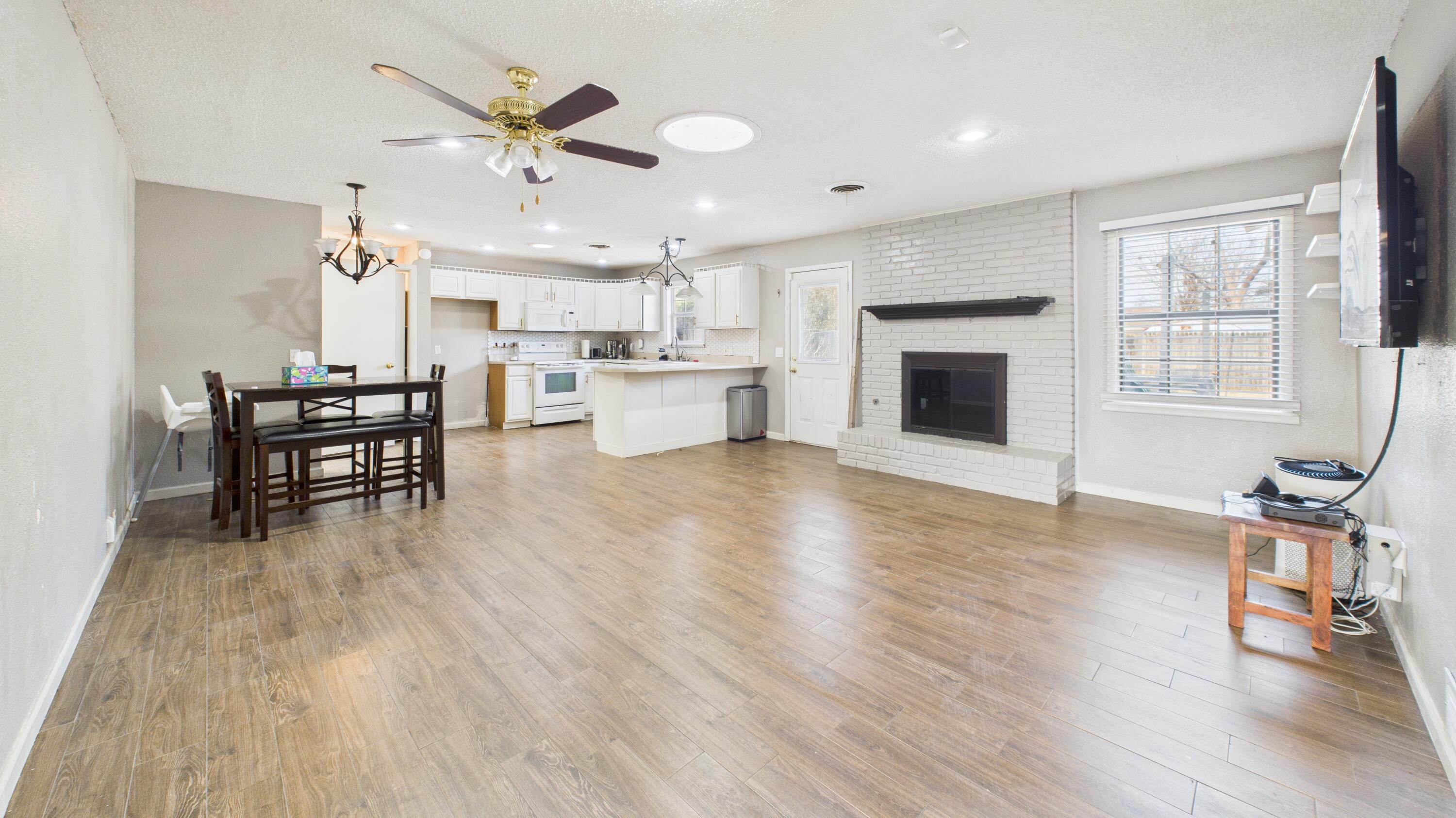 5410 41st Street Lubbock, TX 79414 - Photo 18 of 40 a view of a dining room with furniture window and wooden floor