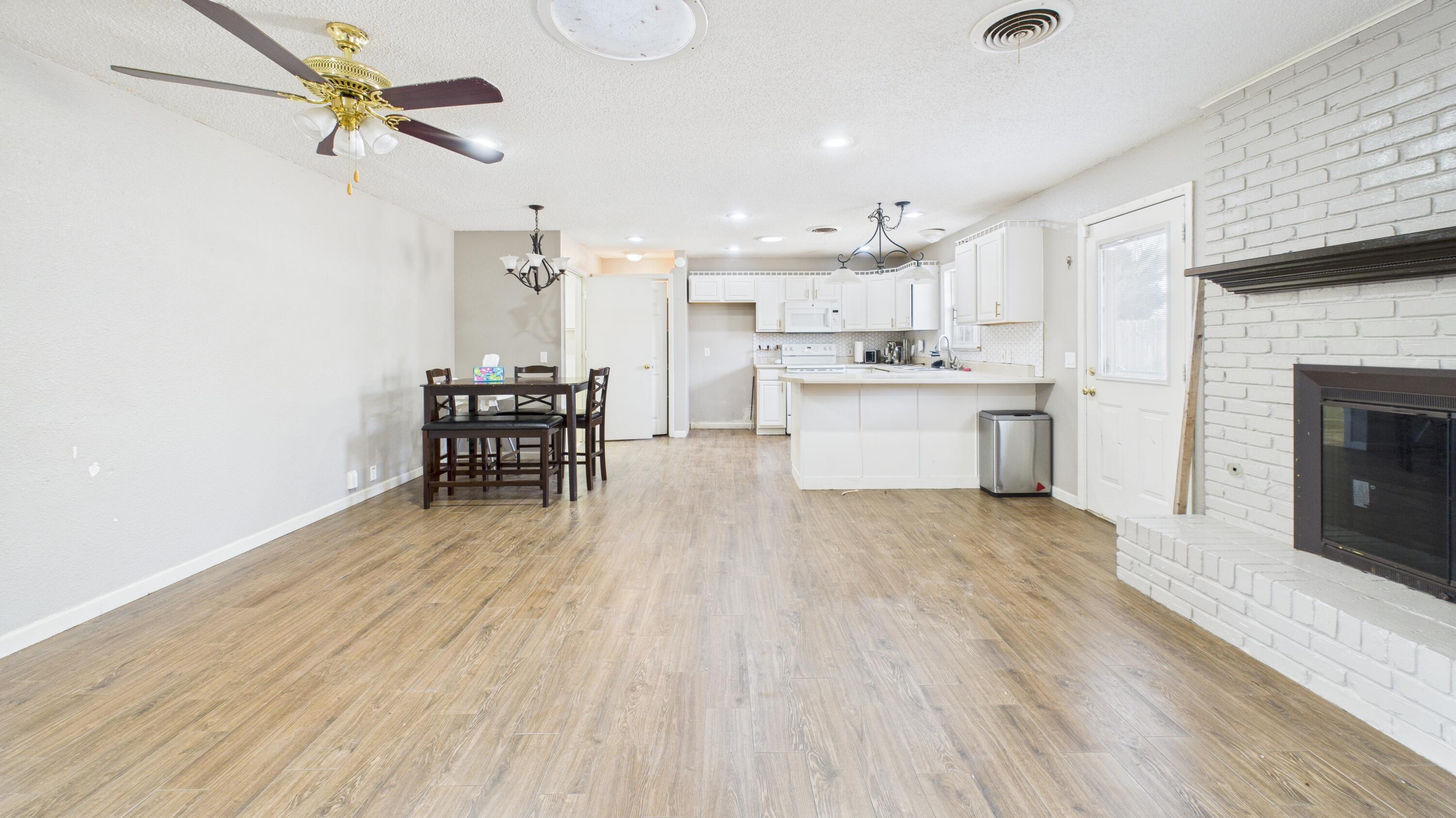 5410 41st Street Lubbock, TX 79414 - Photo 19 of 40 a open kitchen with cabinets a sink and appliances