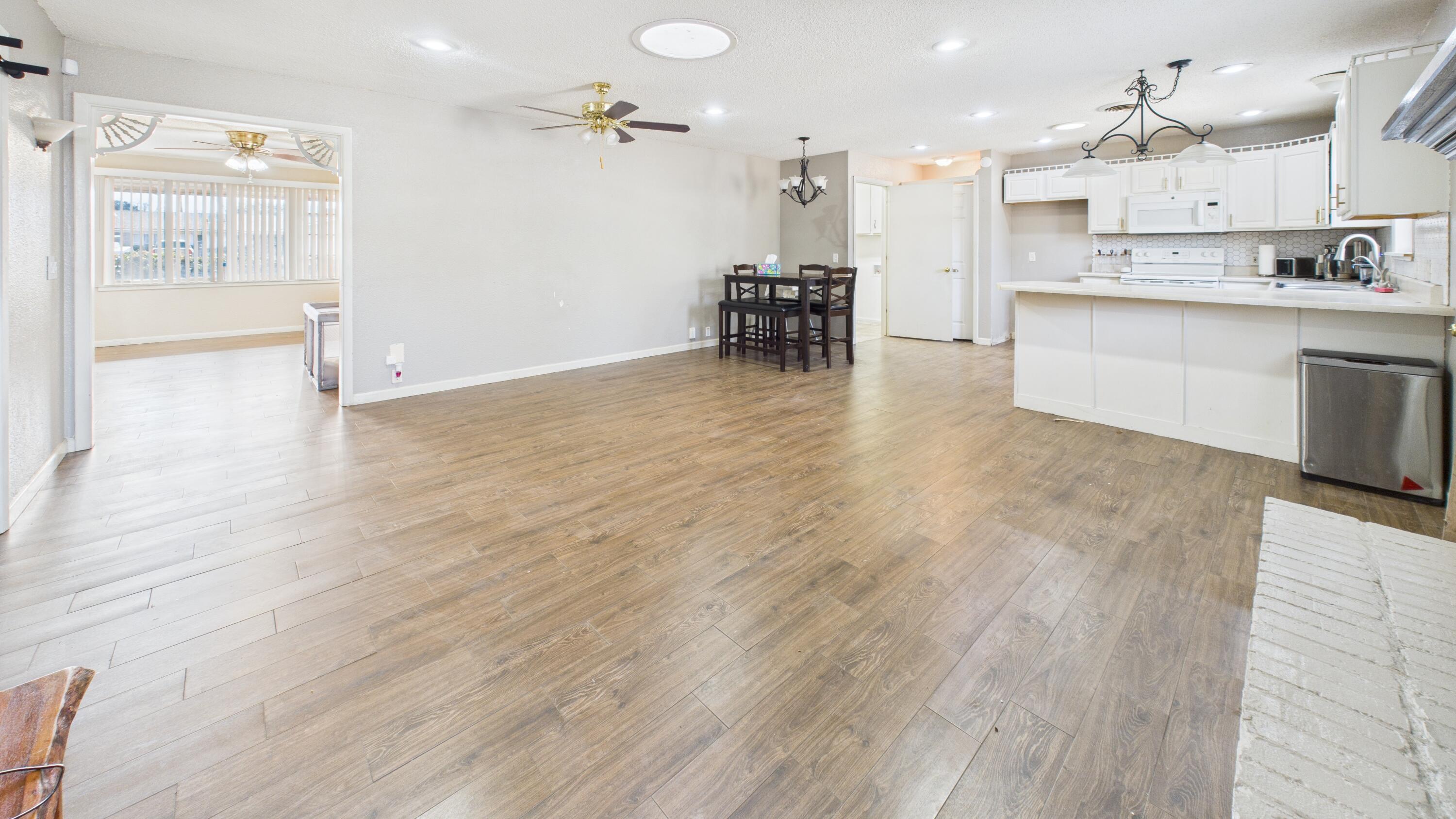 5410 41st Street Lubbock, TX 79414 - Photo 20 of 40 a view of kitchen with cabinets and wooden floor