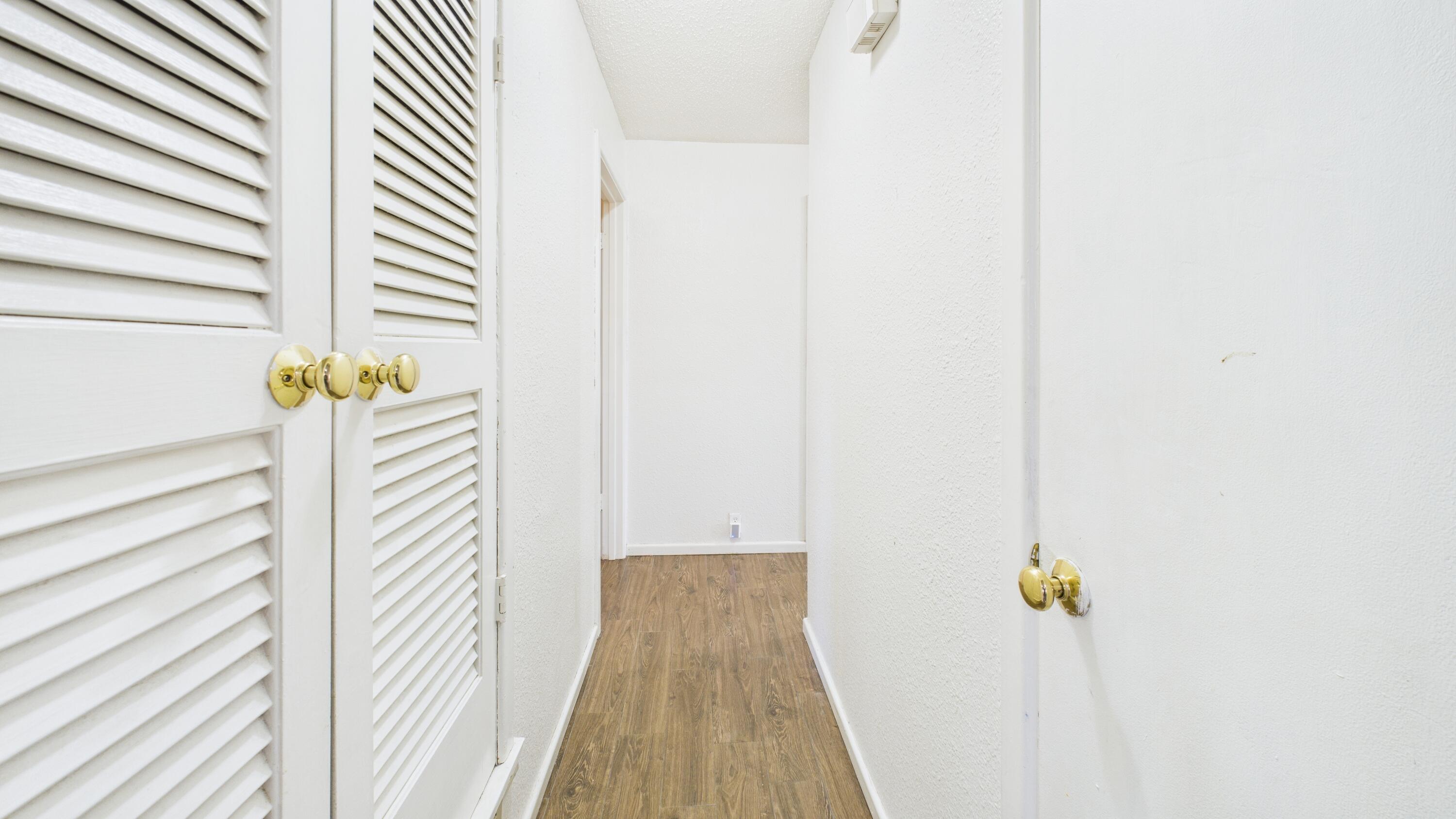 5410 41st Street Lubbock, TX 79414 - Photo 26 of 40 a view of a hallway with wooden floor and staircase