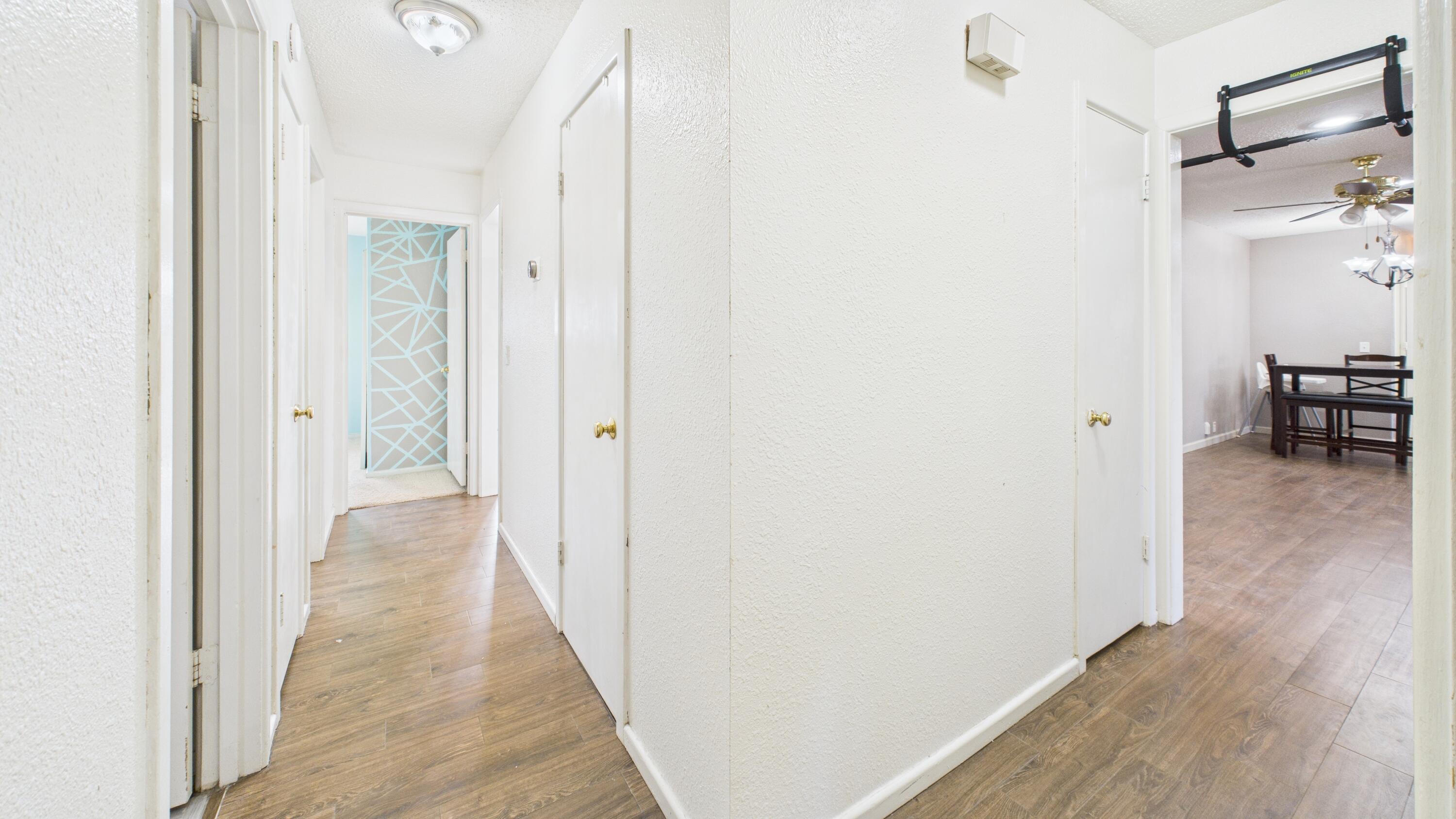 5410 41st Street Lubbock, TX 79414 - Photo 27 of 40 a view of a hallway with wooden floor