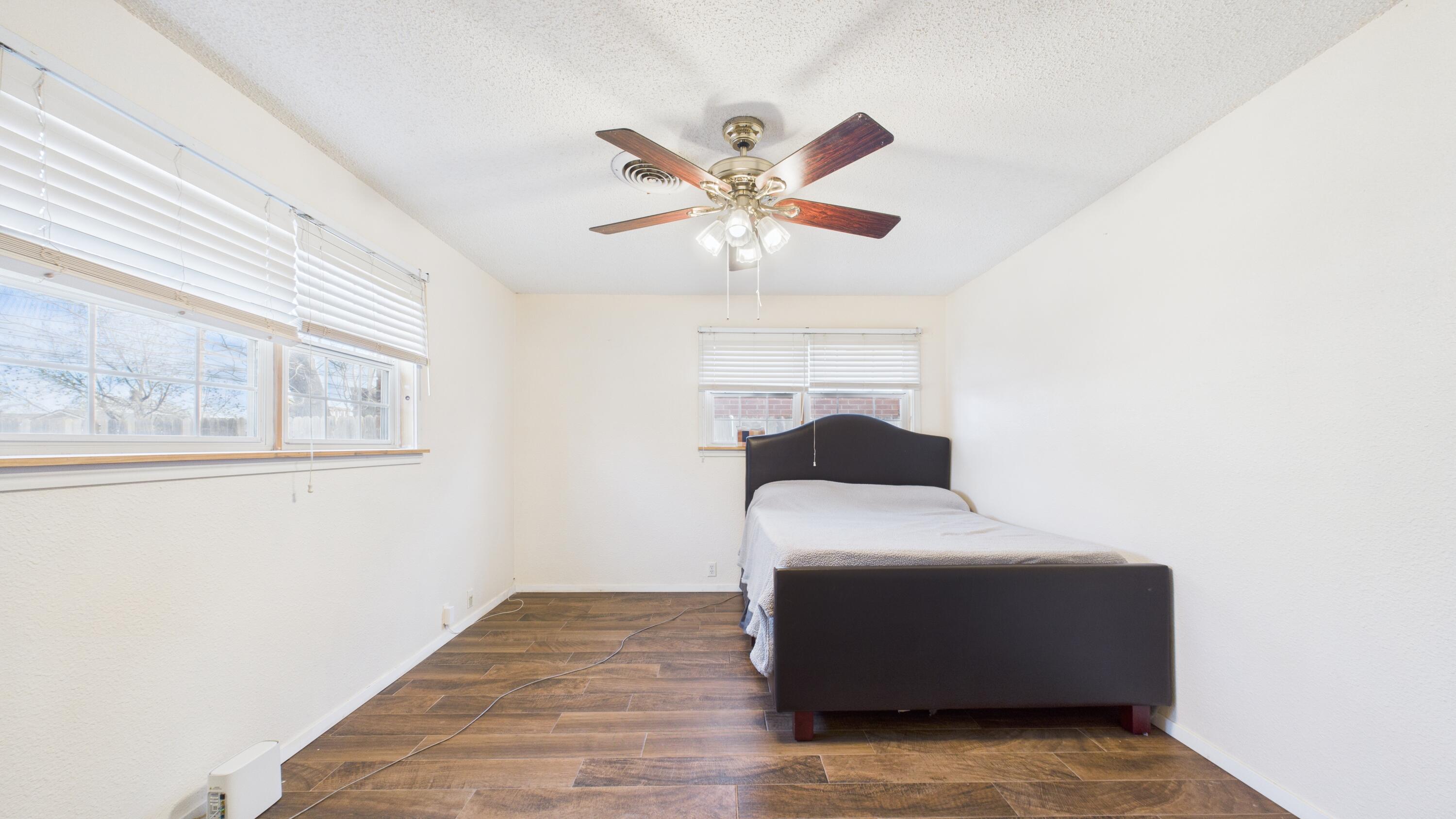 5410 41st Street Lubbock, TX 79414 - Photo 28 of 40 a bedroom with a bed and a window