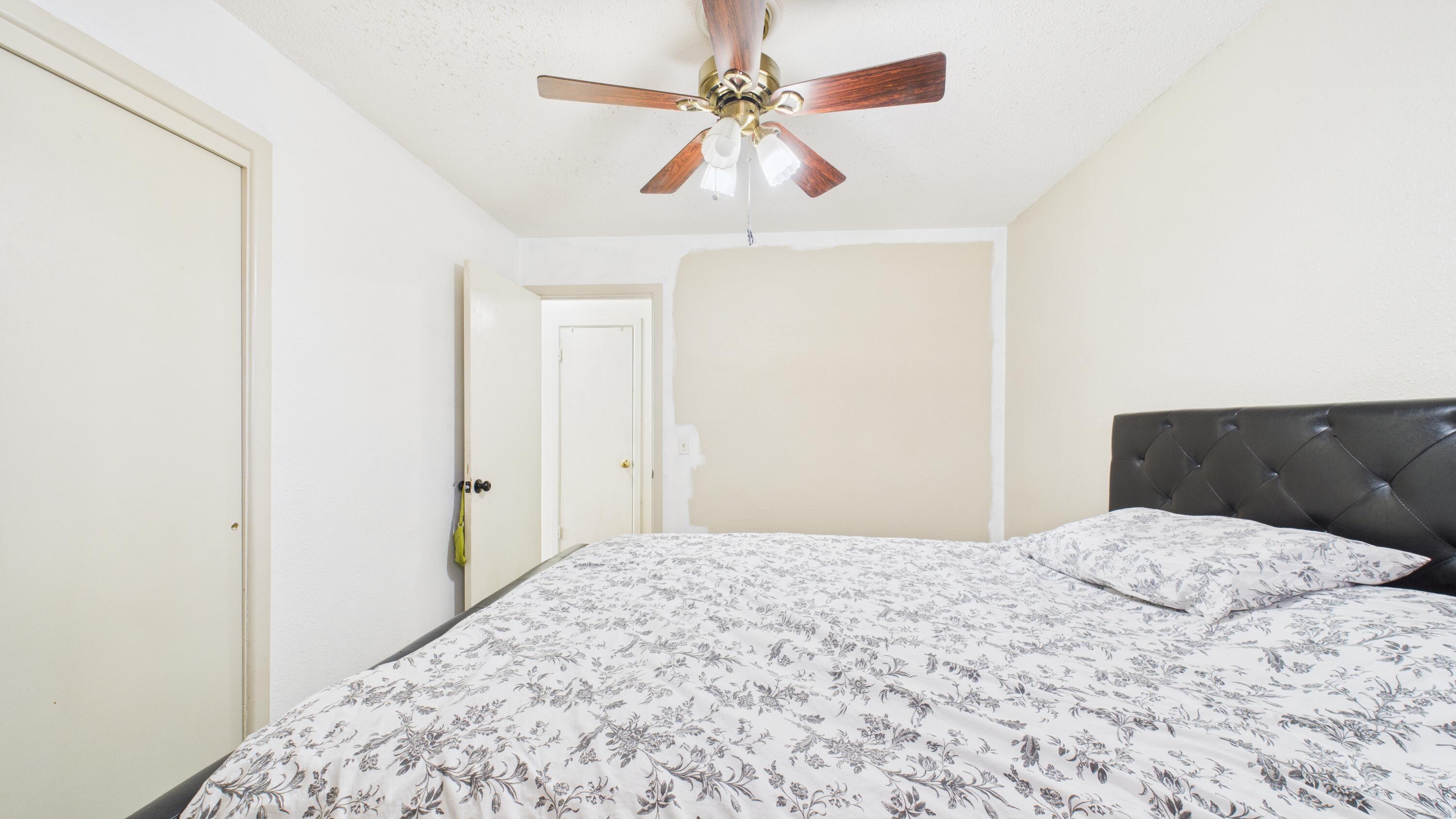 5410 41st Street Lubbock, TX 79414 - Photo 33 of 40 a bedroom with a bed and a ceiling fan