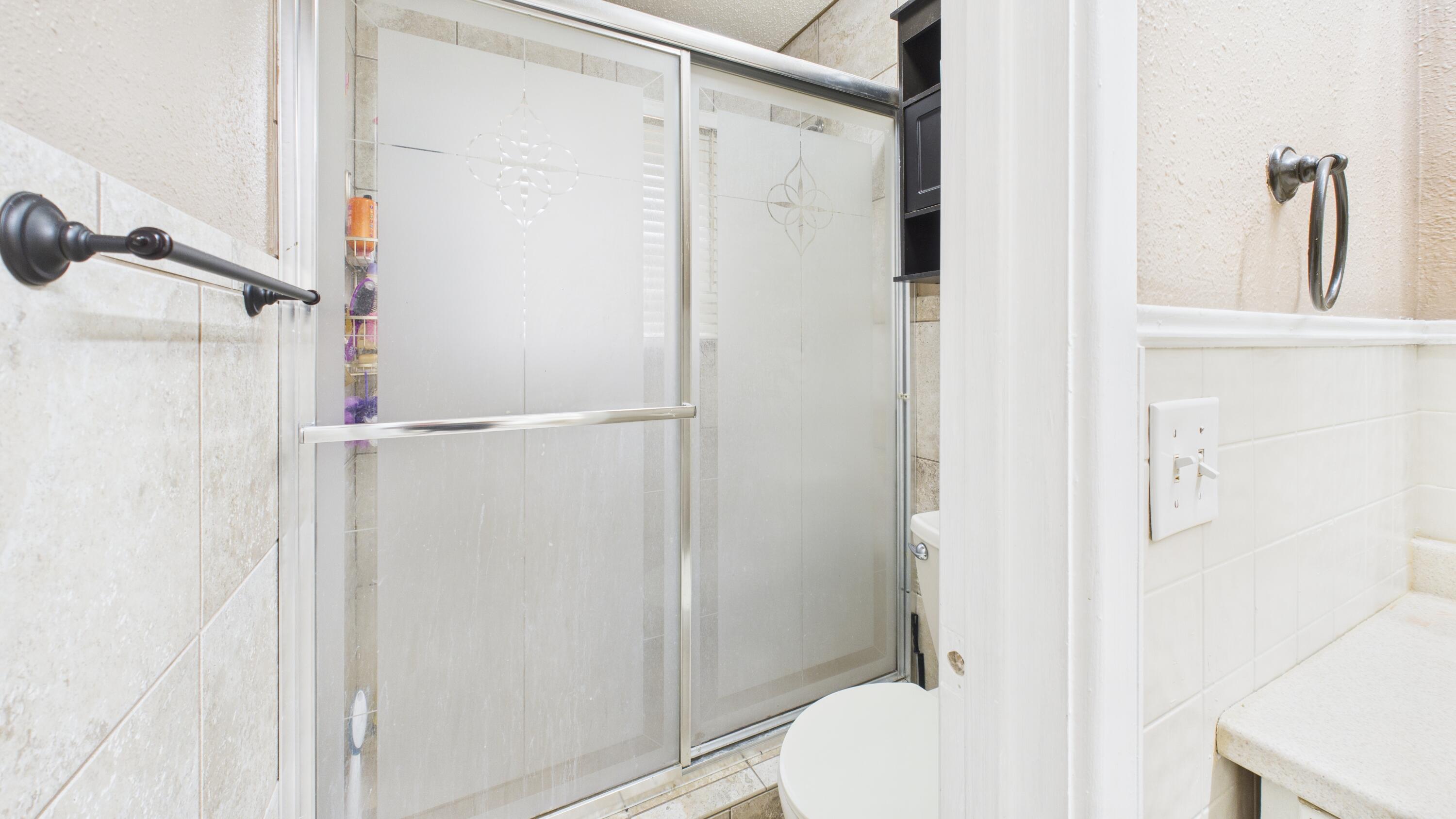 5410 41st Street Lubbock, TX 79414 - Photo 37 of 40 a bathroom with a shower and a toilet