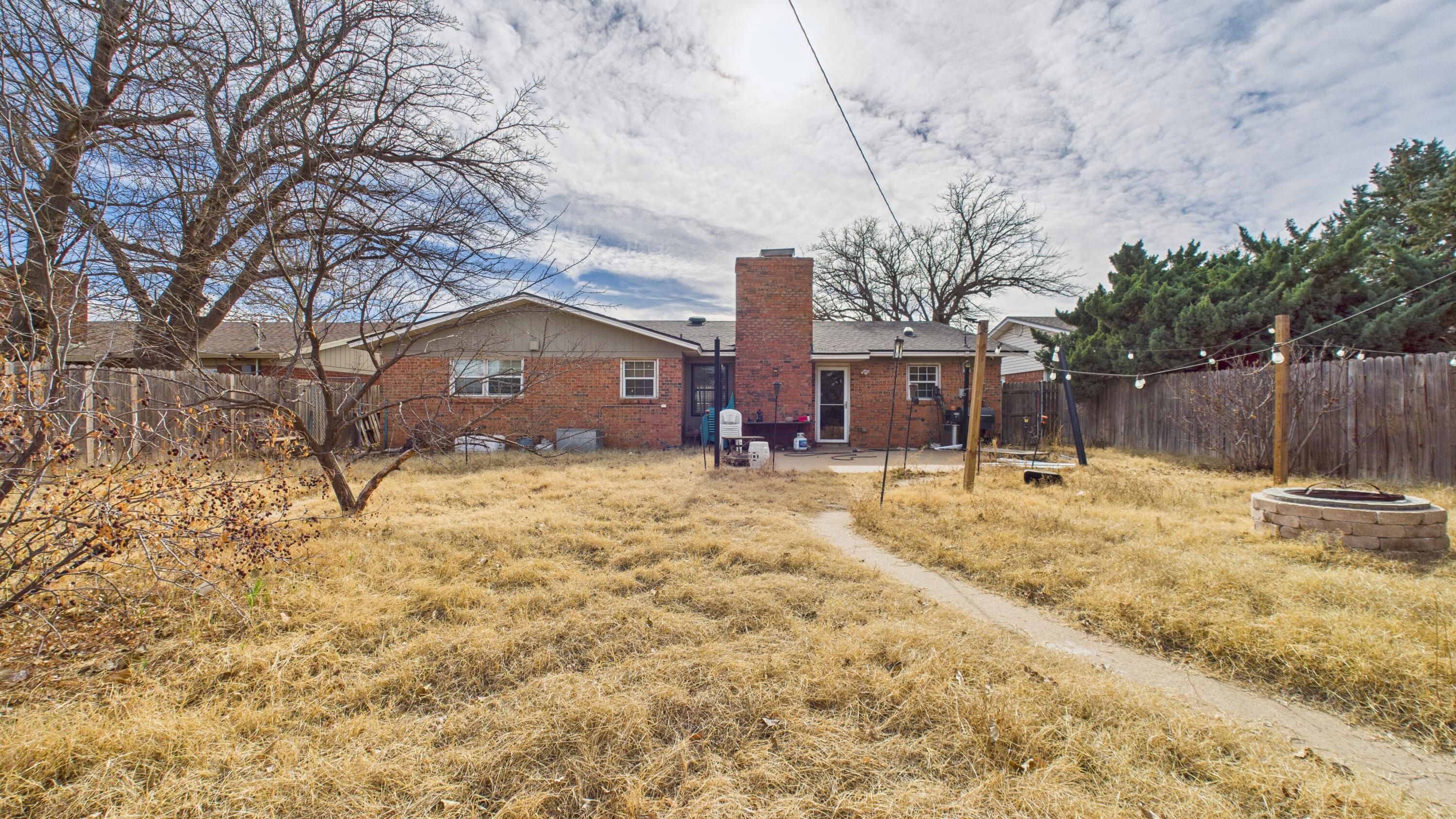 5410 41st Street Lubbock, TX 79414 - Photo 40 of 40 a house that has a tree in front of it