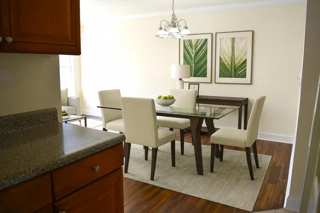 a view of a dining room with furniture and wooden floor