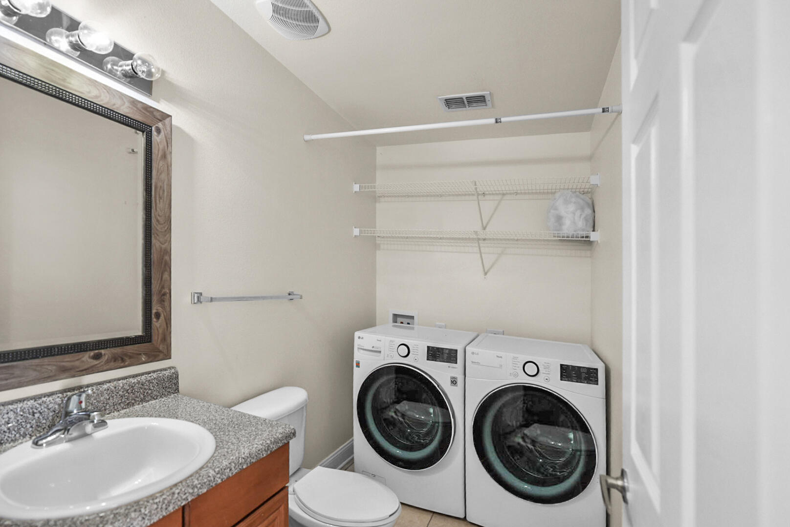 506 Wingspan Way Crestview, FL 32536 - Photo 12 of 33 a bathroom with a sink and a mirror