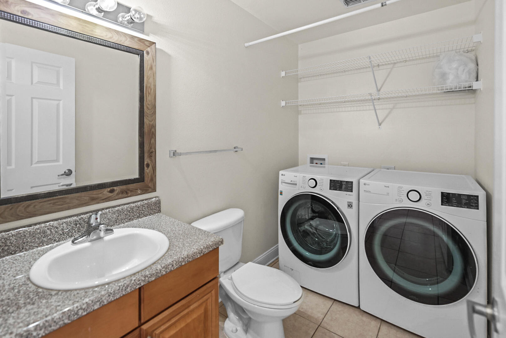506 Wingspan Way Crestview, FL 32536 - Photo 13 of 33 a bathroom with a sink a toilet and a mirror