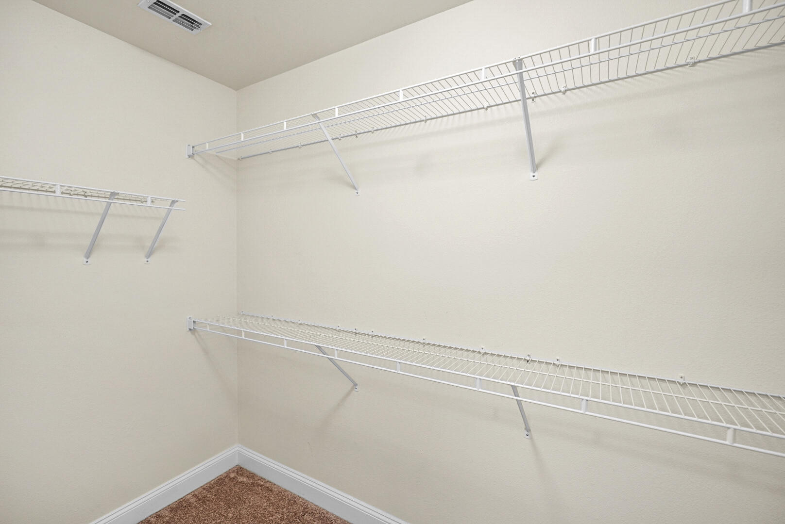 506 Wingspan Way Crestview, FL 32536 - Photo 19 of 33 a view of a room with racks on the wall