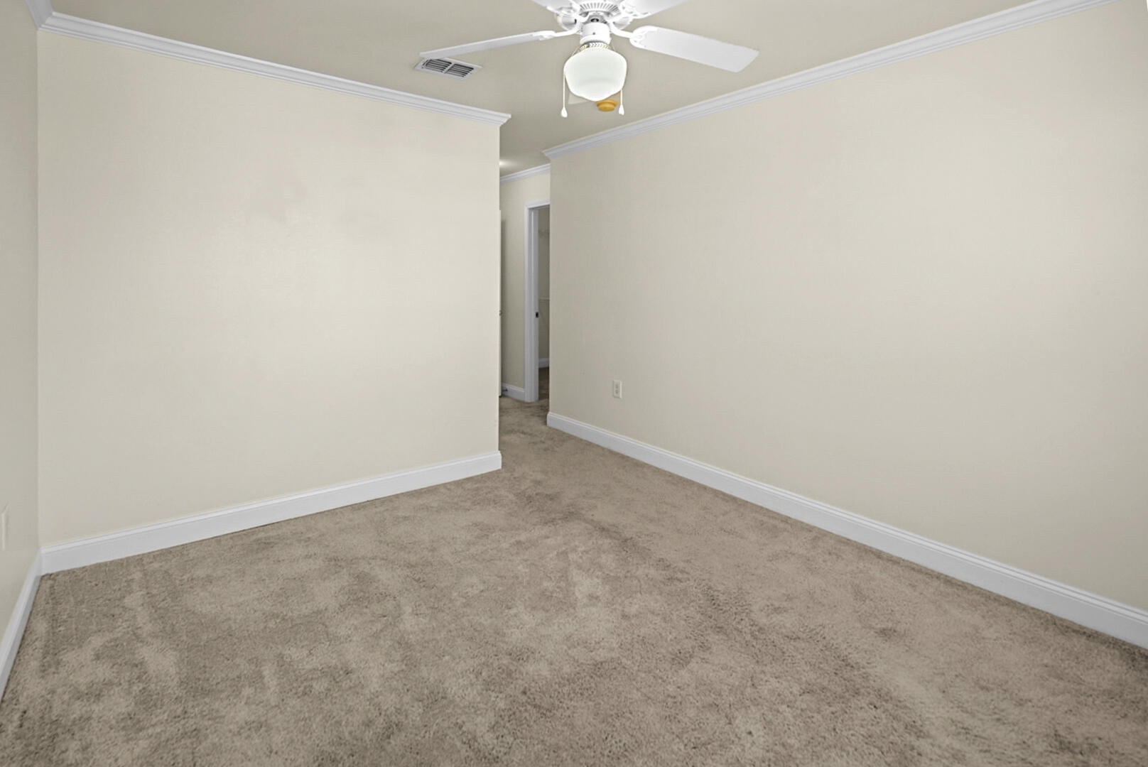 506 Wingspan Way Crestview, FL 32536 - Photo 22 of 33 an empty room with a chandelier fan and closet