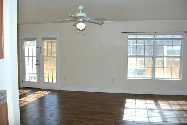 a view of an empty room with a window