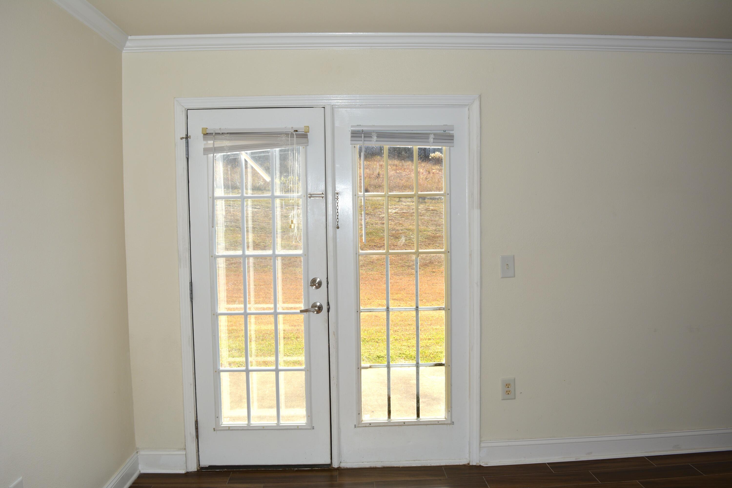 506 Wingspan Way Crestview, FL 32536 - Photo 25 of 38 a view of an empty room with a window