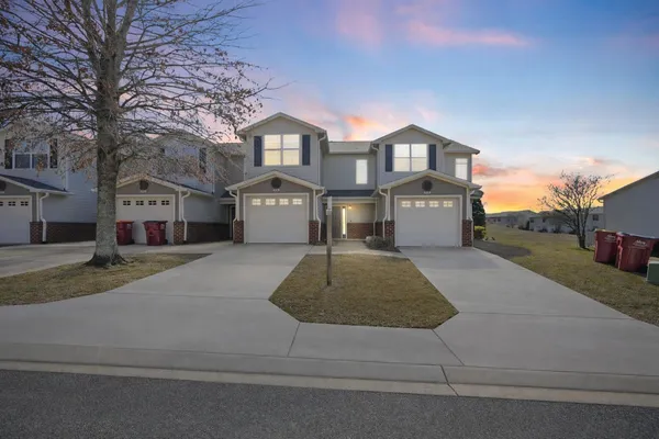 a front view of a house with a garage
