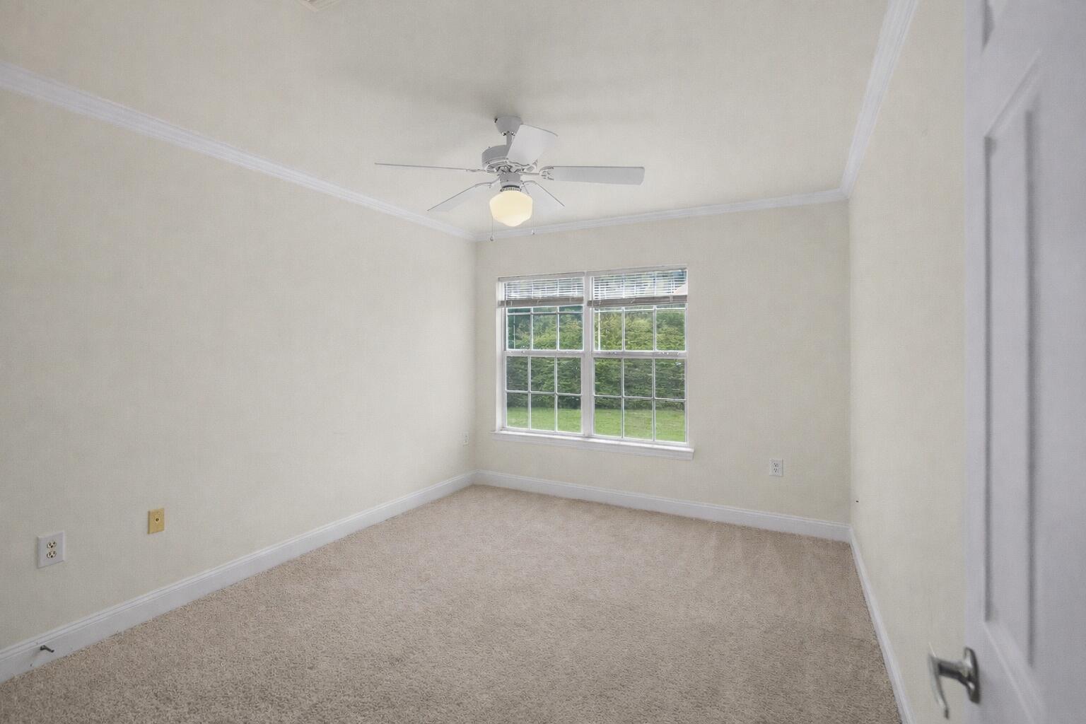 506 Wingspan Way Crestview, FL 32536 - Photo 33 of 33 an empty room with a window and a fan