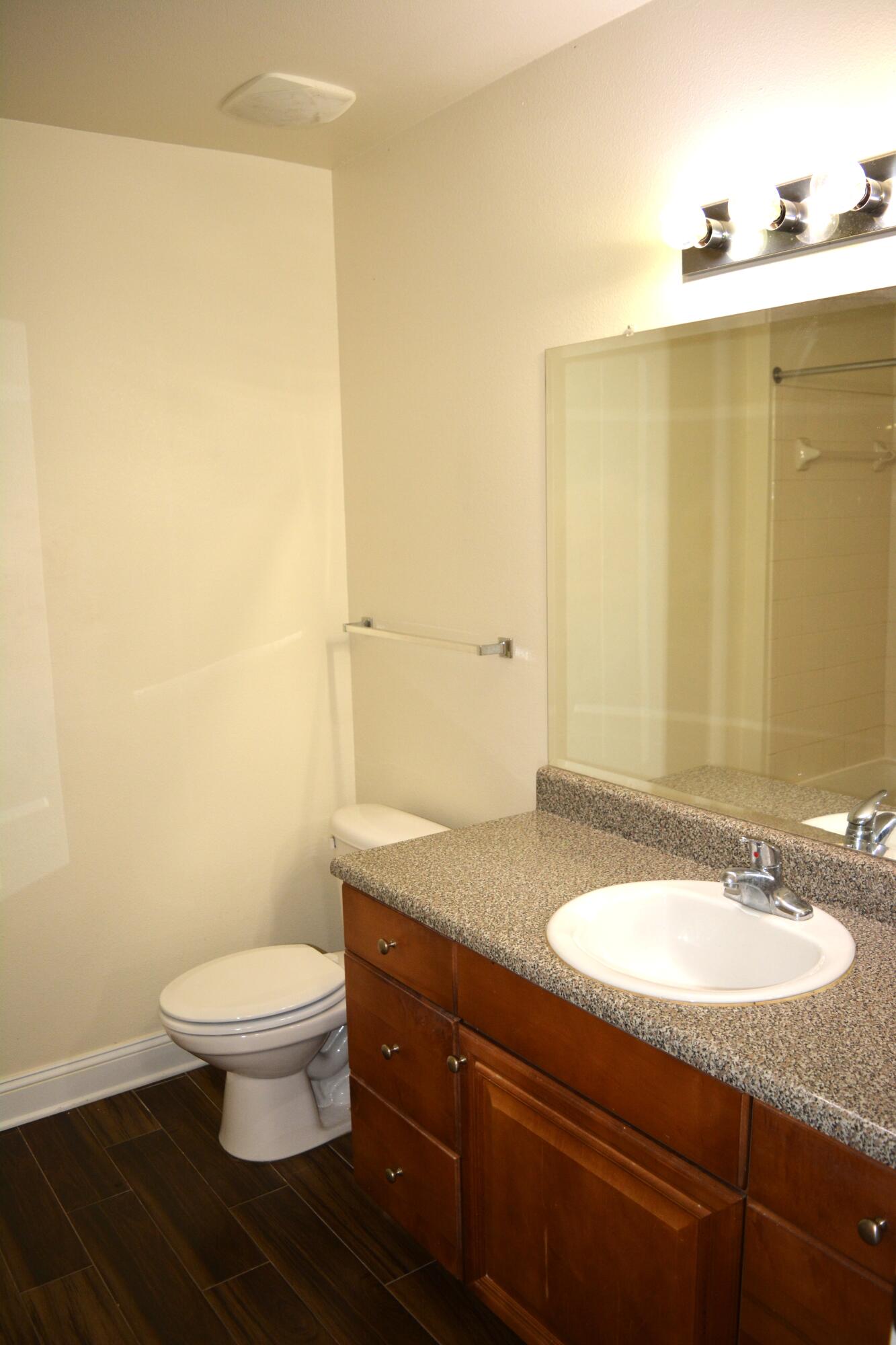 506 Wingspan Way Crestview, FL 32536 - Photo 33 of 38 a bathroom with a granite countertop sink and a mirror