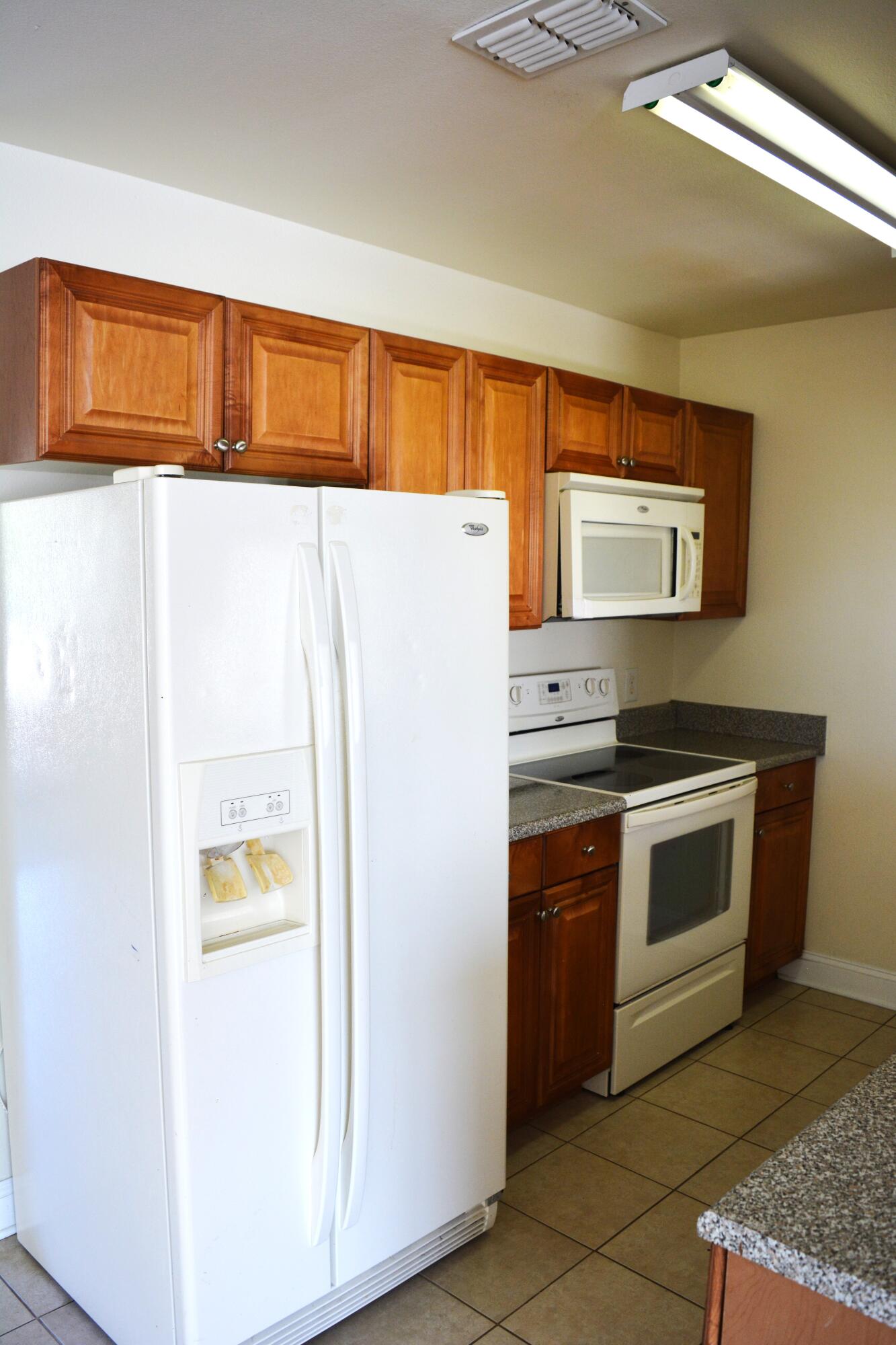 506 Wingspan Way Crestview, FL 32536 - Photo 37 of 38 a kitchen with stainless steel appliances a refrigerator and a stove