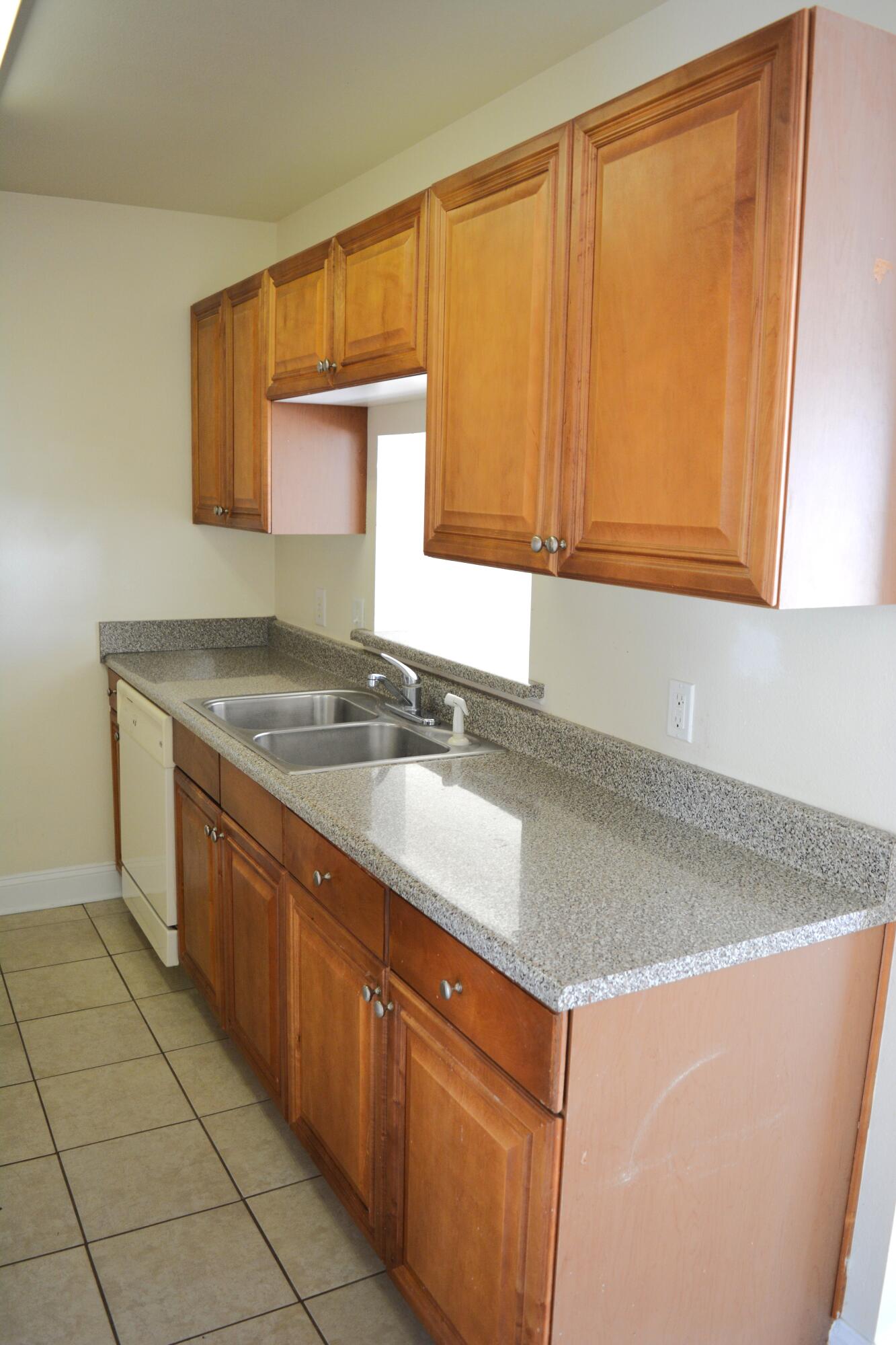 506 Wingspan Way Crestview, FL 32536 - Photo 38 of 38 a kitchen with stainless steel appliances granite countertop a sink and a white cabinets