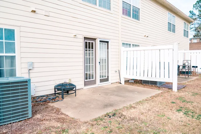 a view of a backyard with a patio