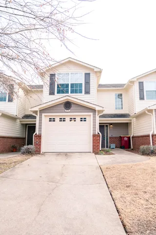 a view of a house with large windows
