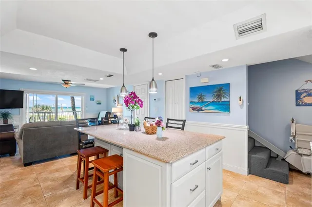 a view of a dining table chairs and chandelier