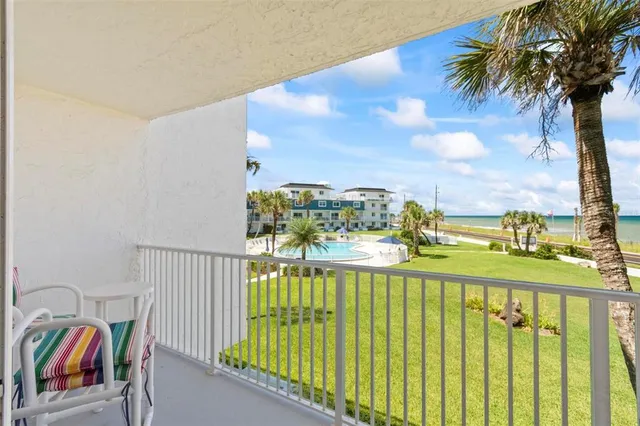 a view of a balcony with an outdoor space