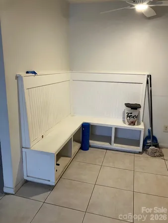 a bathroom with a tub shower and vanity