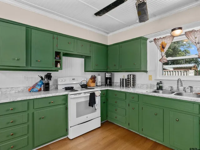 a kitchen with lots of counter space and a window