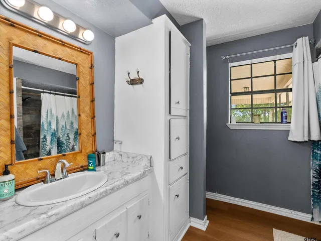 a work room with furniture wooden floor and a book shelf