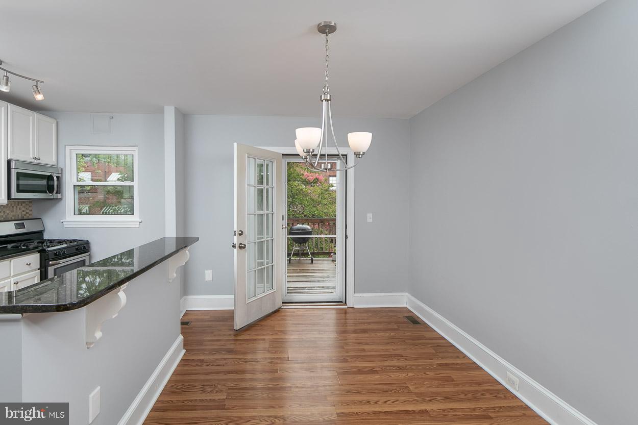 3703 Elkader Road Baltimore, MD 21218 - Photo 10 of 34 Spacious Dining Rooom leads to outdoor deck
