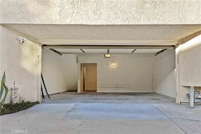 a picture of a bathroom with a picture on the wall and a window