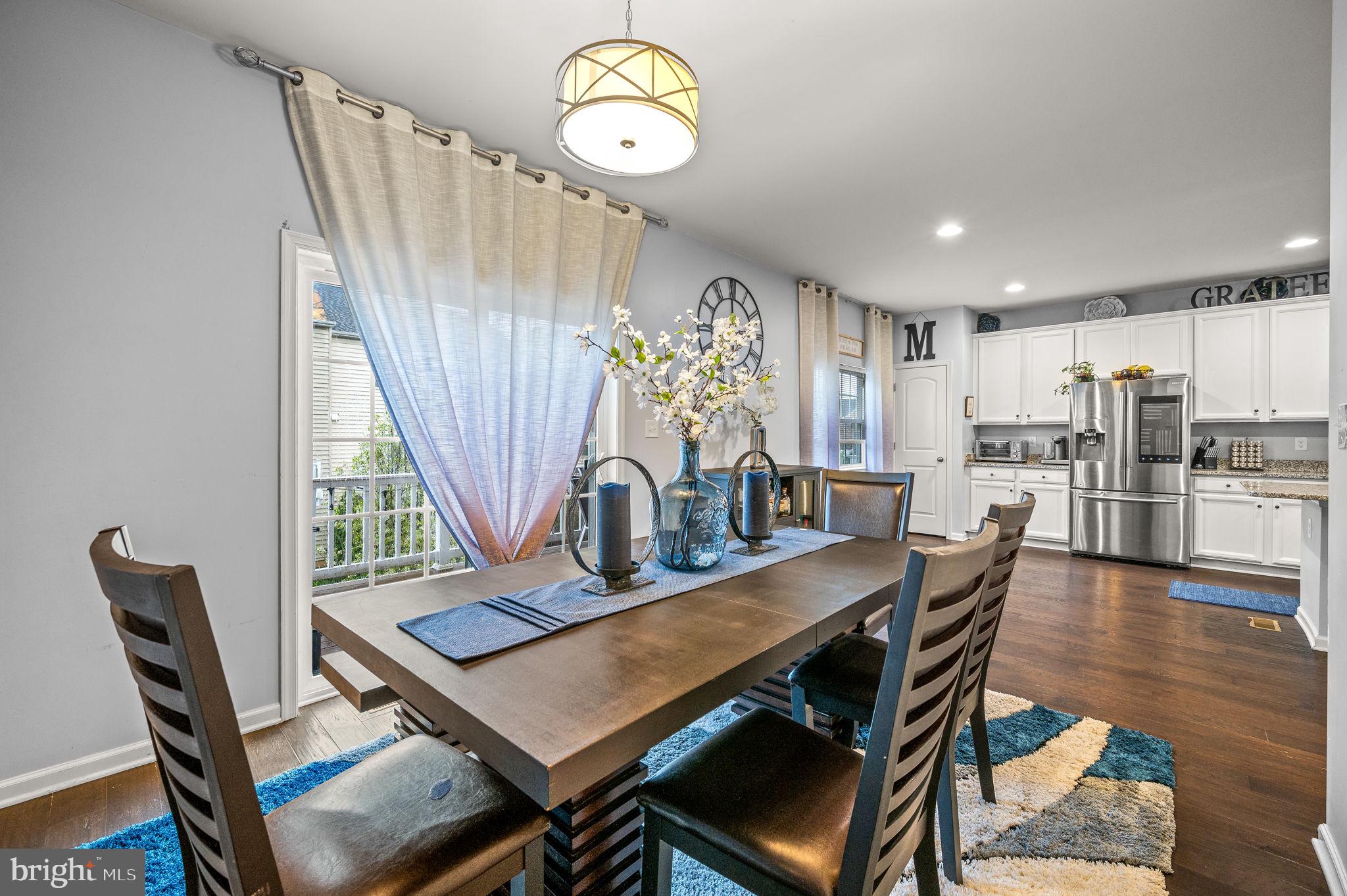 131 Time Circle Bear, DE 19701 - Photo 17 of 35 a view of a dining room with furniture window and wooden floor