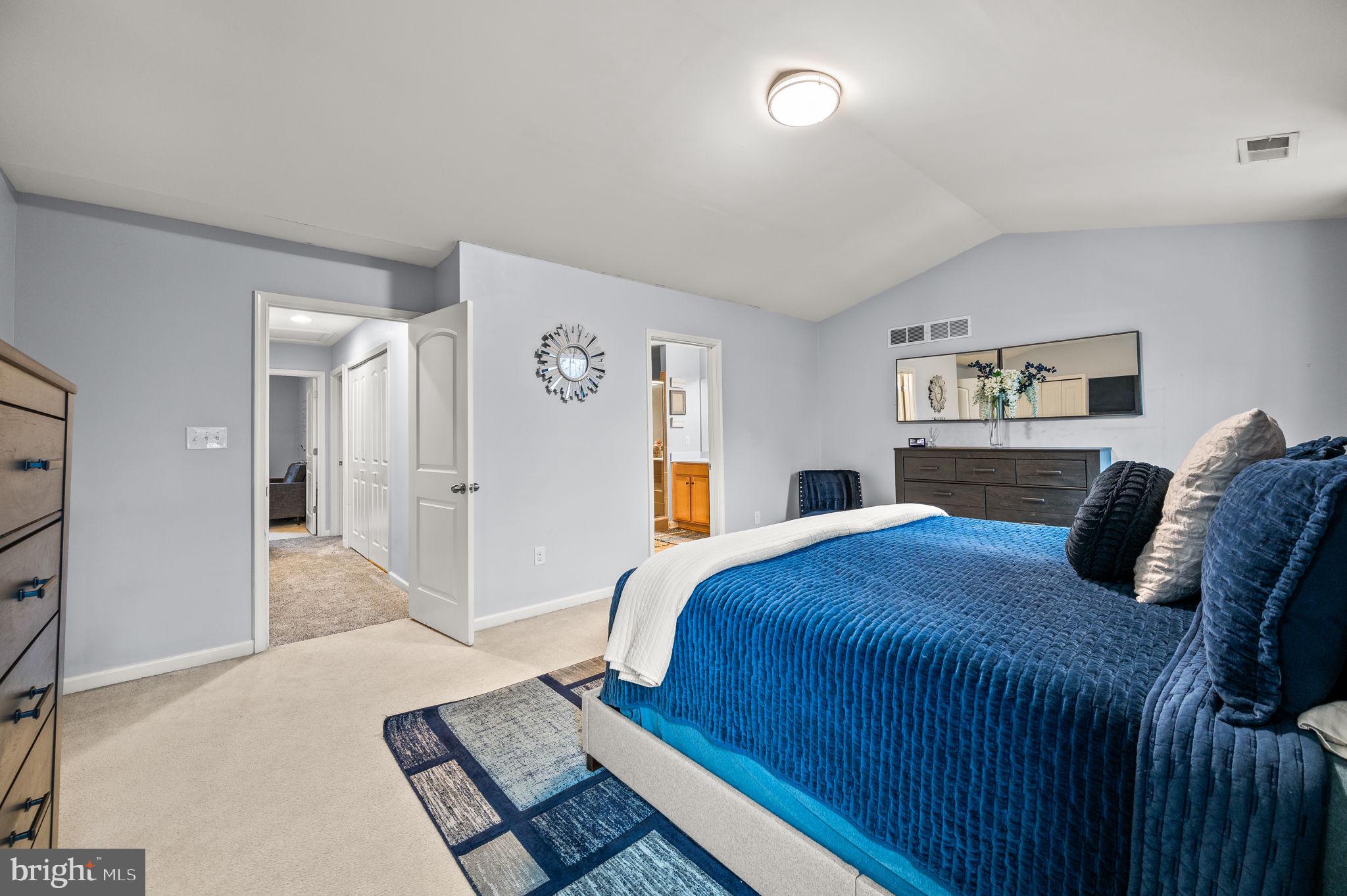 131 Time Circle Bear, DE 19701 - Photo 26 of 35 a bedroom with a large bed and a walk in closet