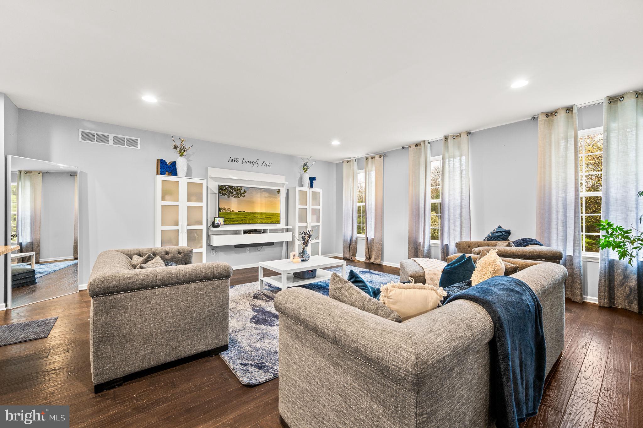 131 Time Circle Bear, DE 19701 - Photo 6 of 35 a living room with furniture and a flat screen tv