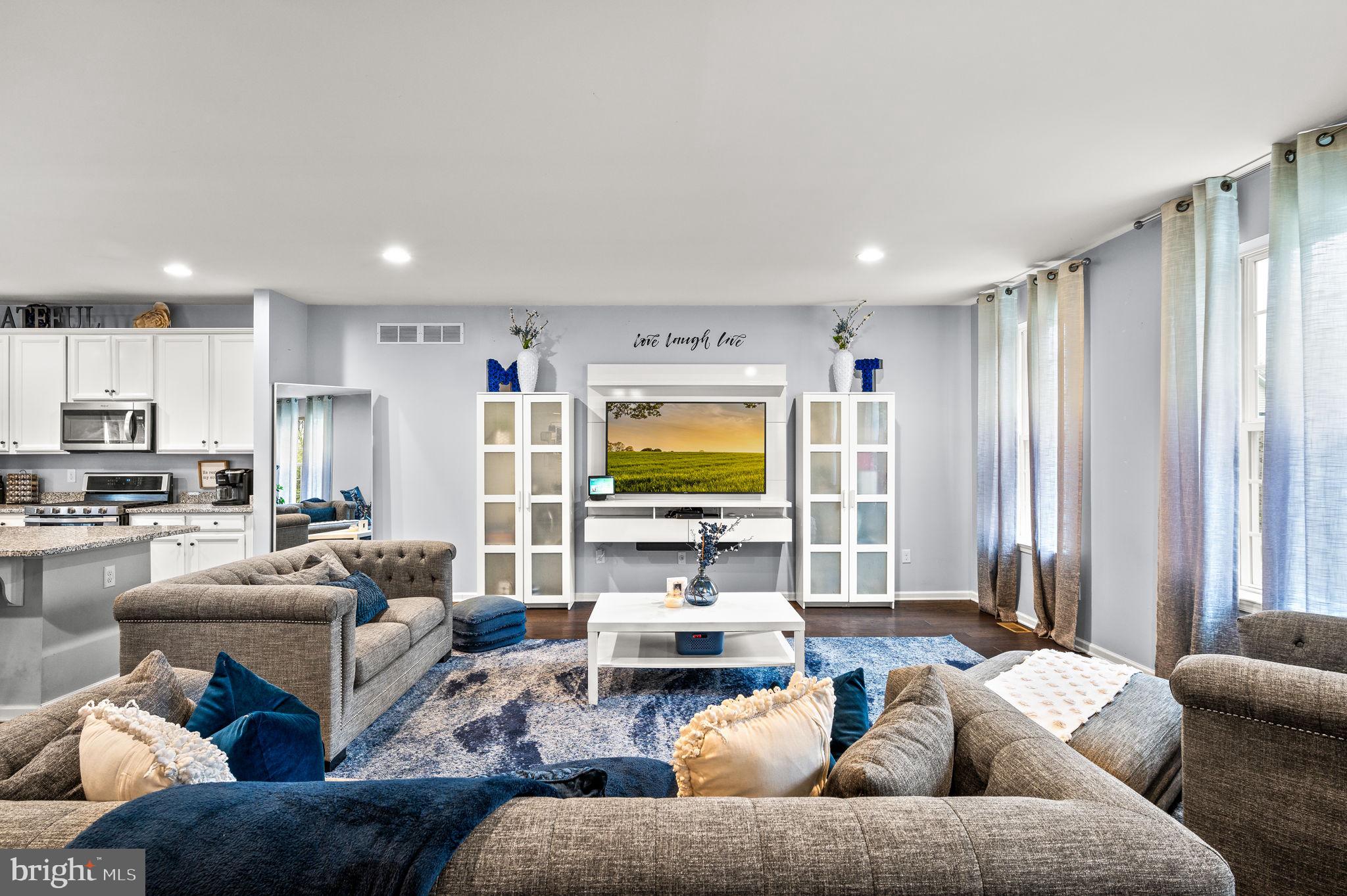 131 Time Circle Bear, DE 19701 - Photo 7 of 35 a living room with furniture kitchen view and a window