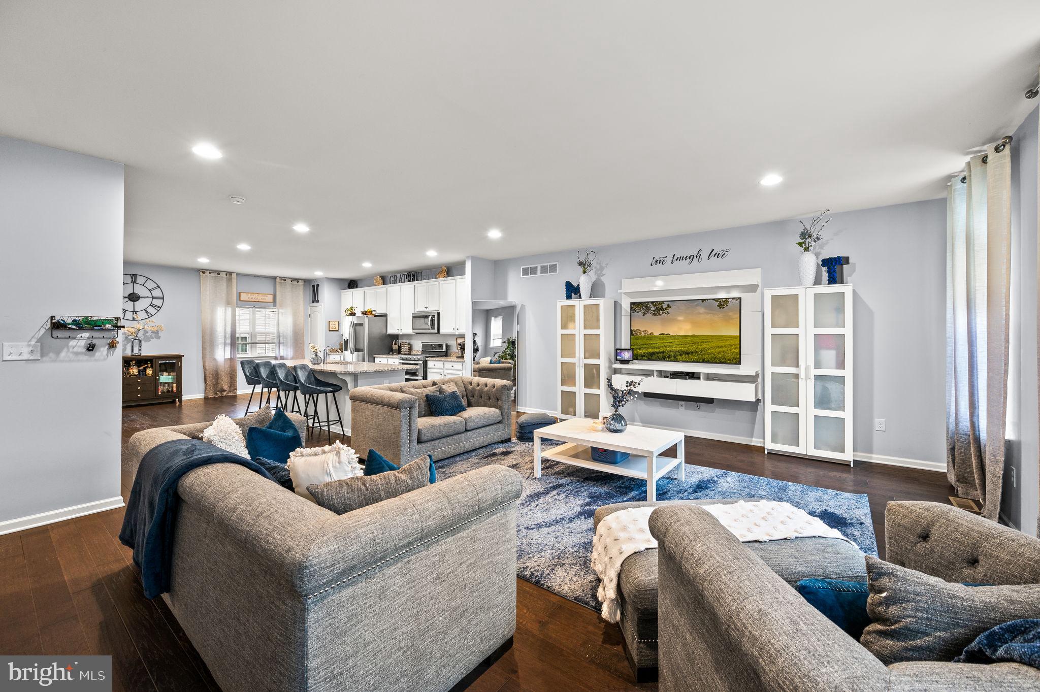 131 Time Circle Bear, DE 19701 - Photo 8 of 35 a living room with furniture kitchen view and a large window