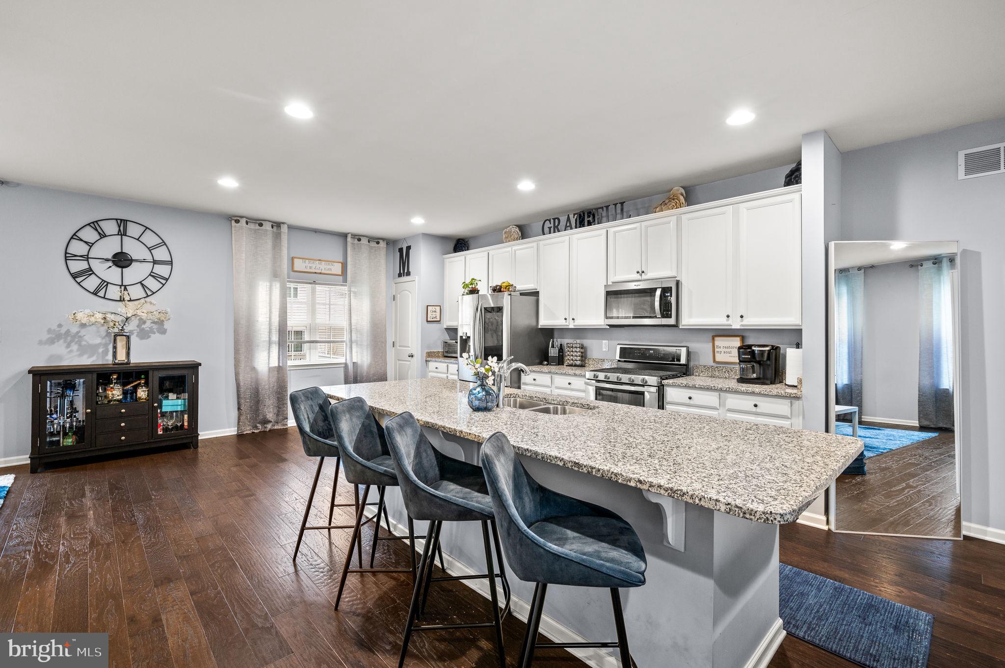 131 Time Circle Bear, DE 19701 - Photo 10 of 35 a view of a dining room with furniture window and wooden floor