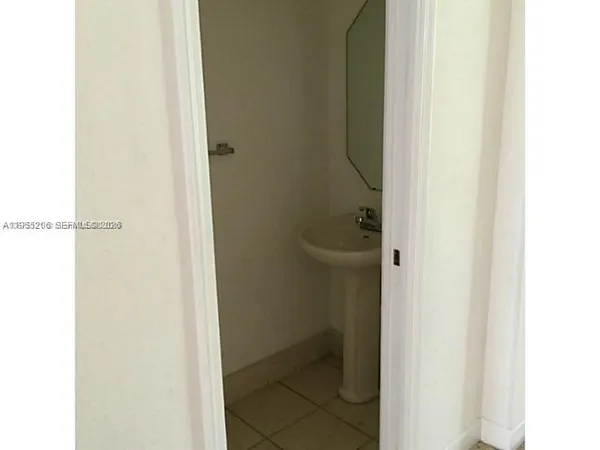 a view of a backyard with pathway