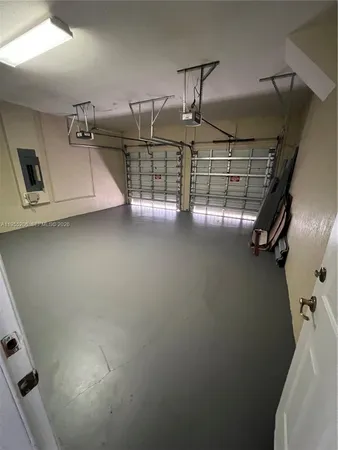 a view of a tennis ground with trees in the background