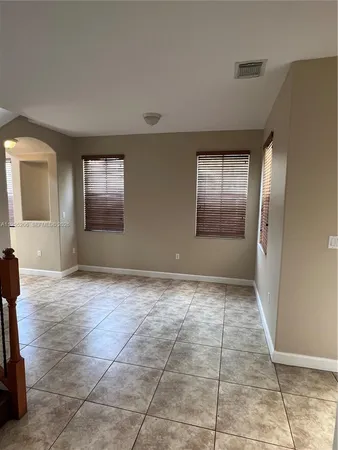 a kitchen with stainless steel appliances granite countertop a sink and a stove