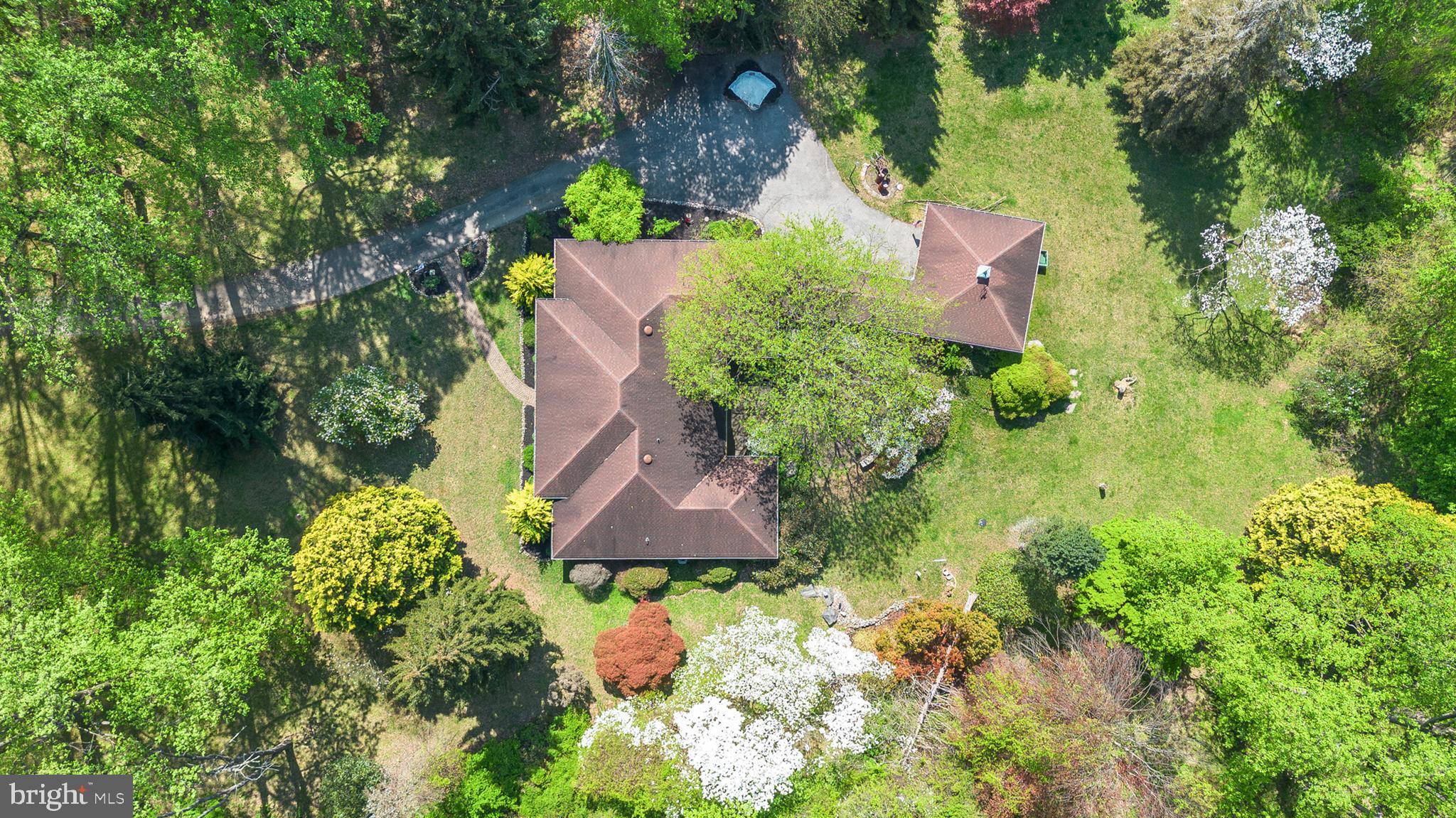 501 Webb Road Chadds Ford, PA 19317 - Photo 2 of 16 an aerial view of a house with a yard and garden